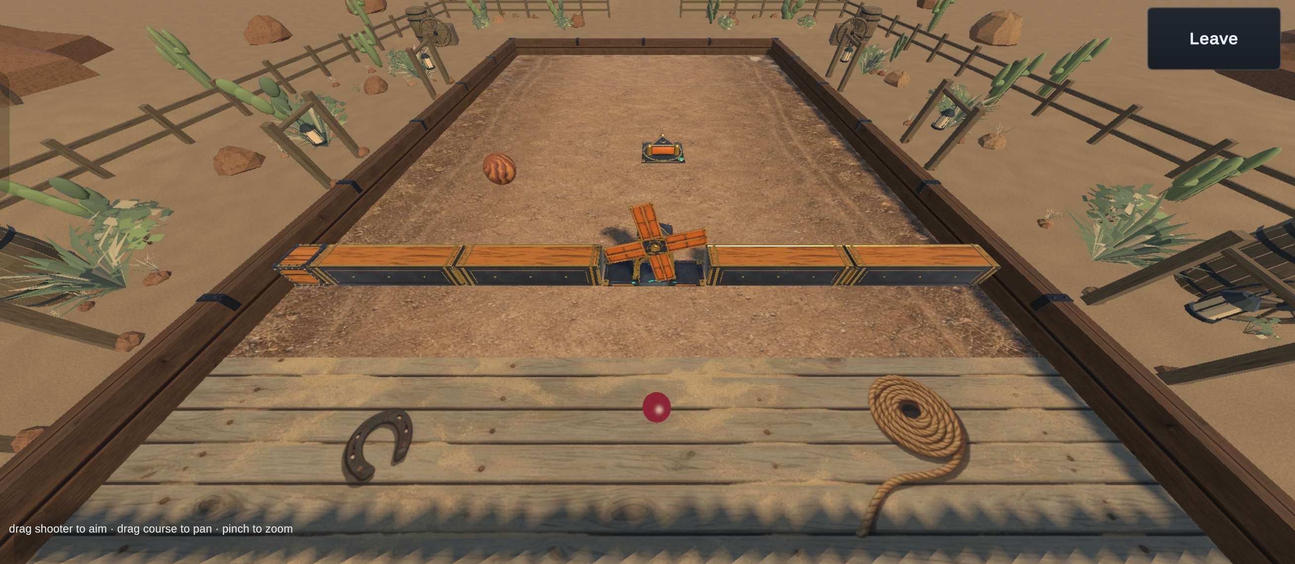 Outmarbled in-game screenshot: a Wild West course on a dirt track, with a windmill set into a wooden wall